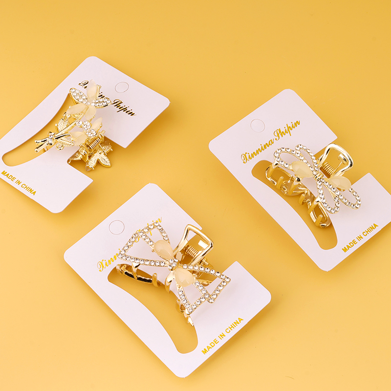 Boxed cat's eye rhinestone alloy middle claw