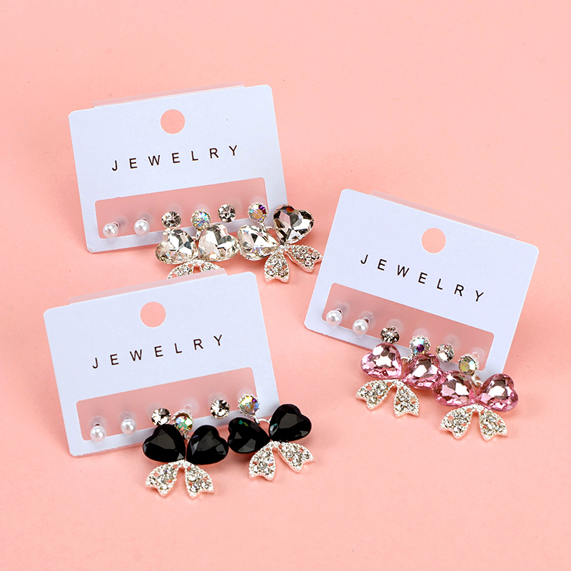 Glaze bow tie with three pairs of stud earrings