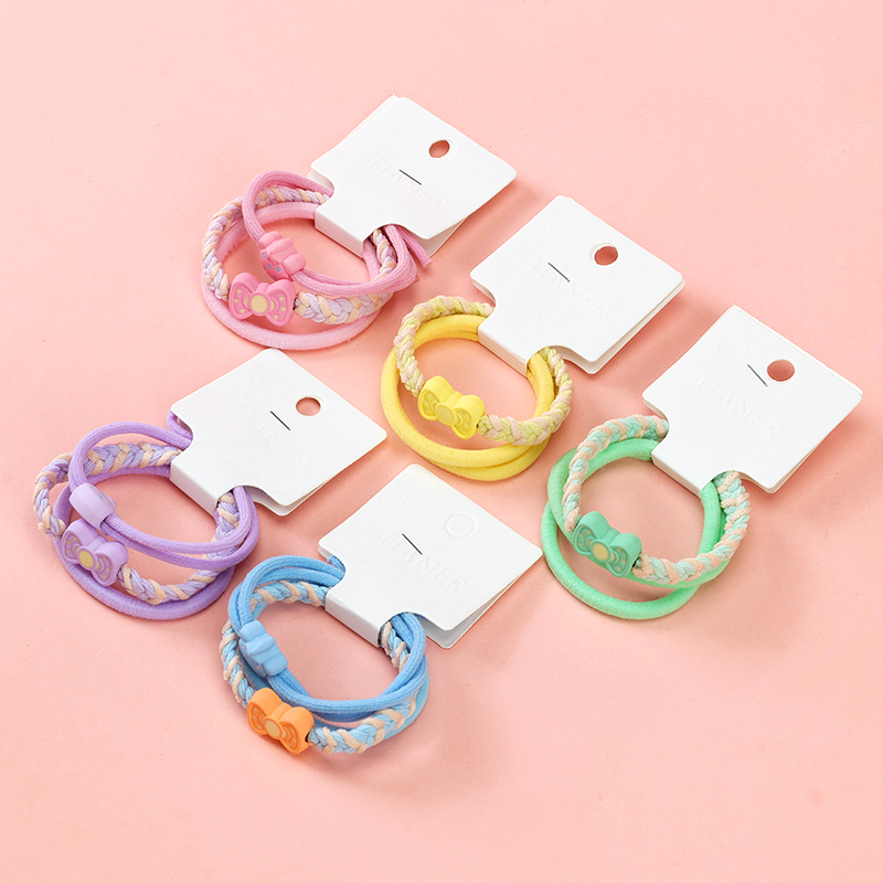 Three colored strawberry bow tie accessories rubber band