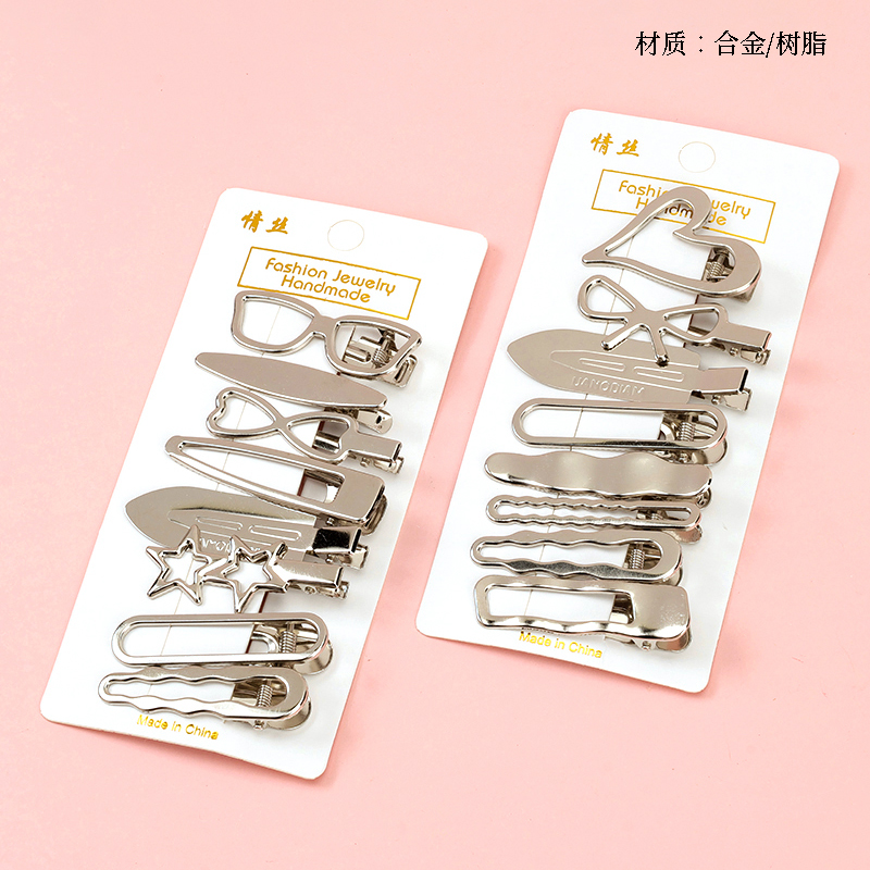 Boxed eight silver shape duck clip