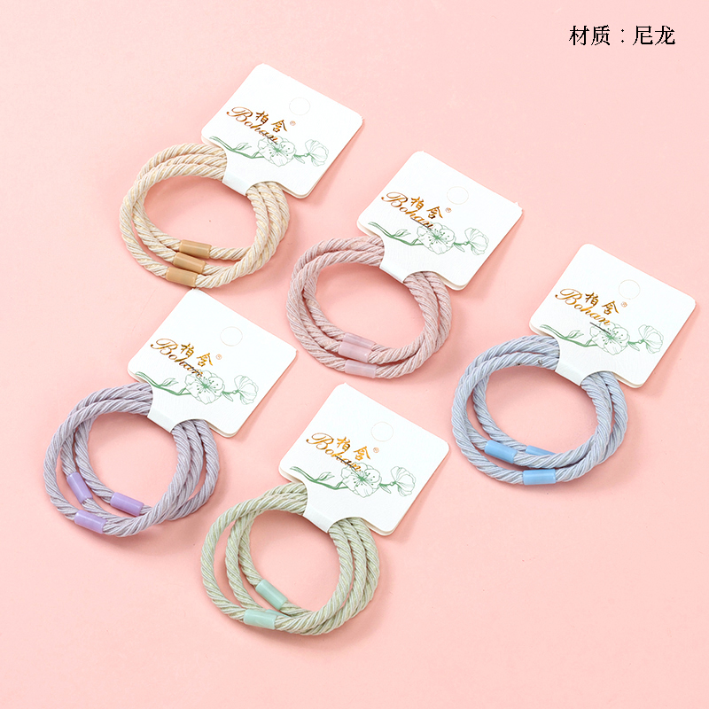 Three colored spiral rubber bands