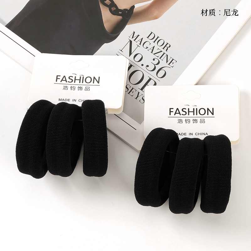 Three black elevator rubber bands