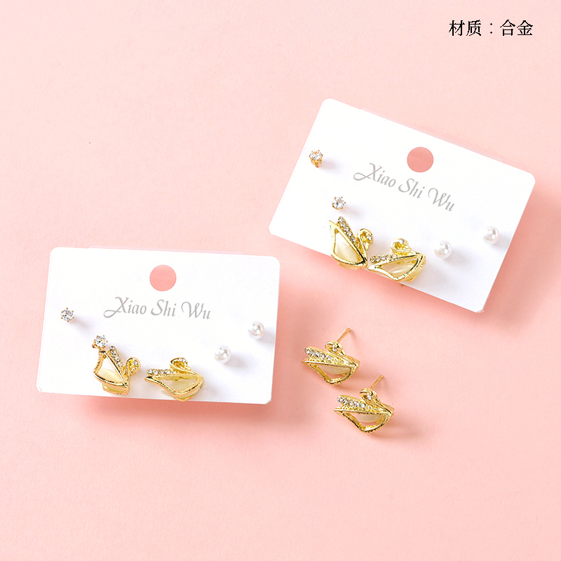 Three pairs of pearl rhinestone stud earrings