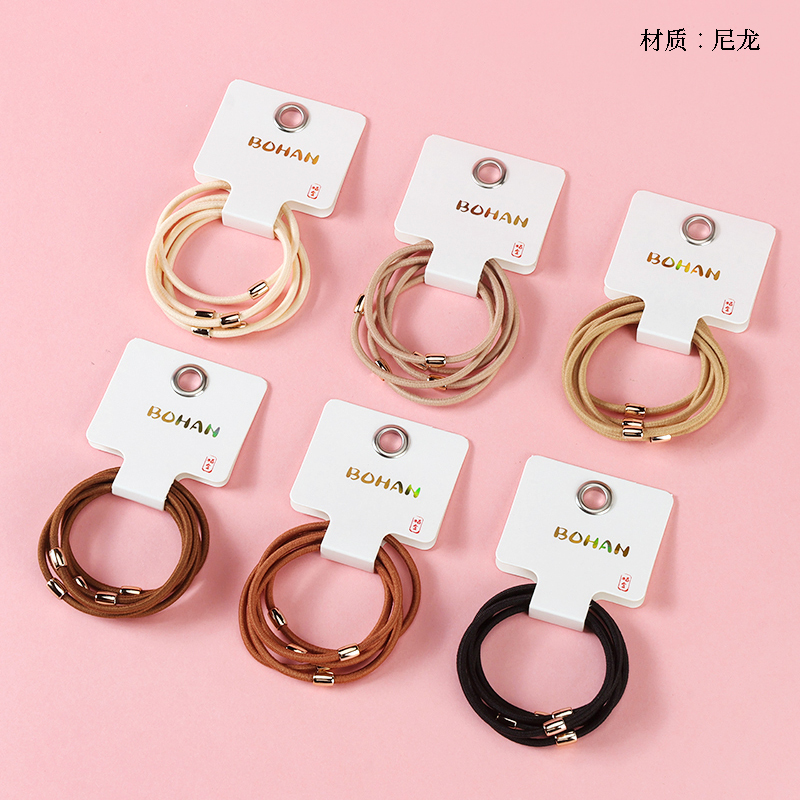 Boxed five brown foundation rubber bands