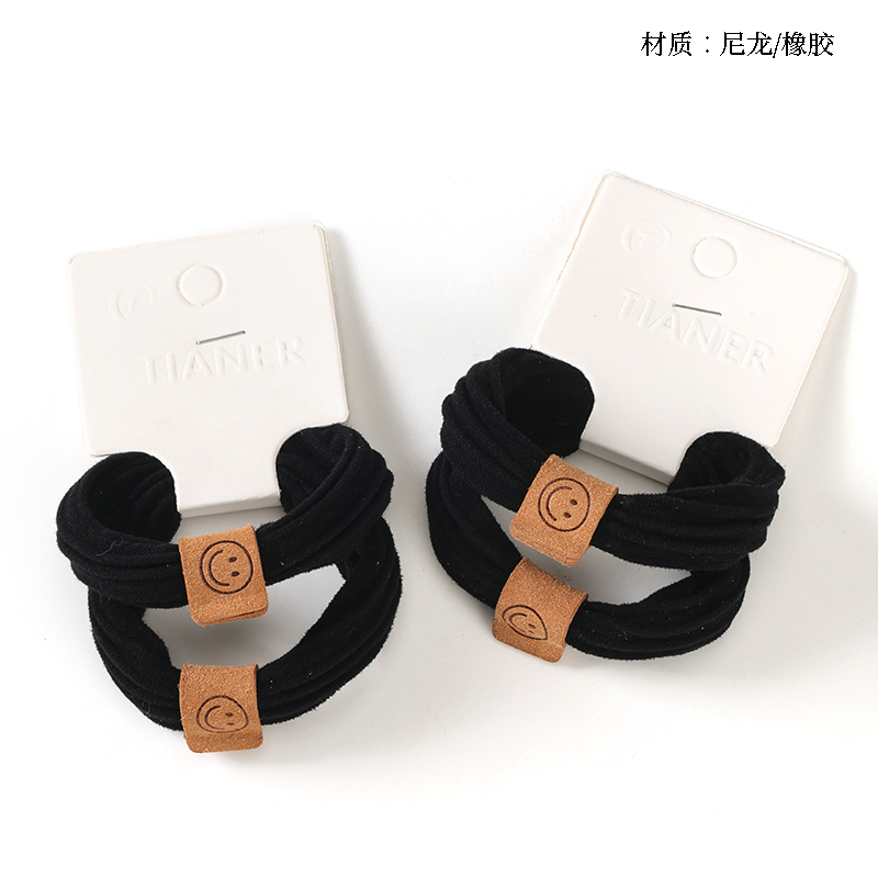 Boxed 2 black labeled rubber bands