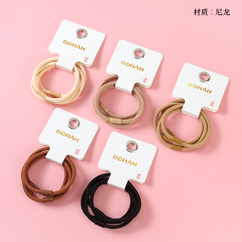 Boxed four brown foundation rubber bands