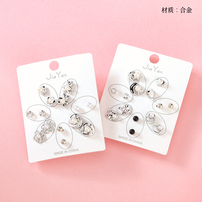 Seven pairs of French pearl bow tie stud earrings