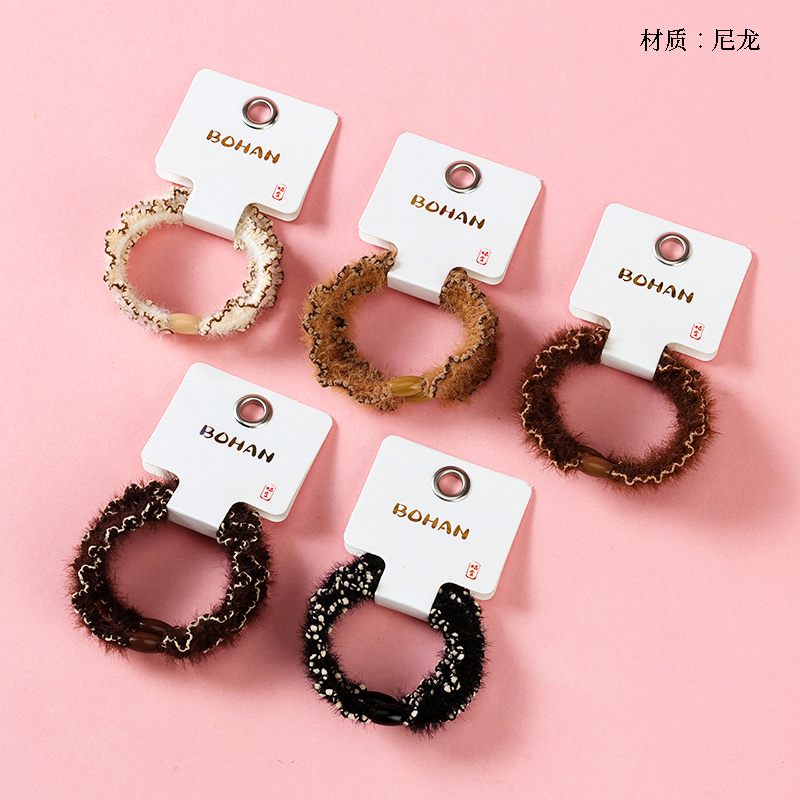 Boxed two curry color plush hem rubber bands