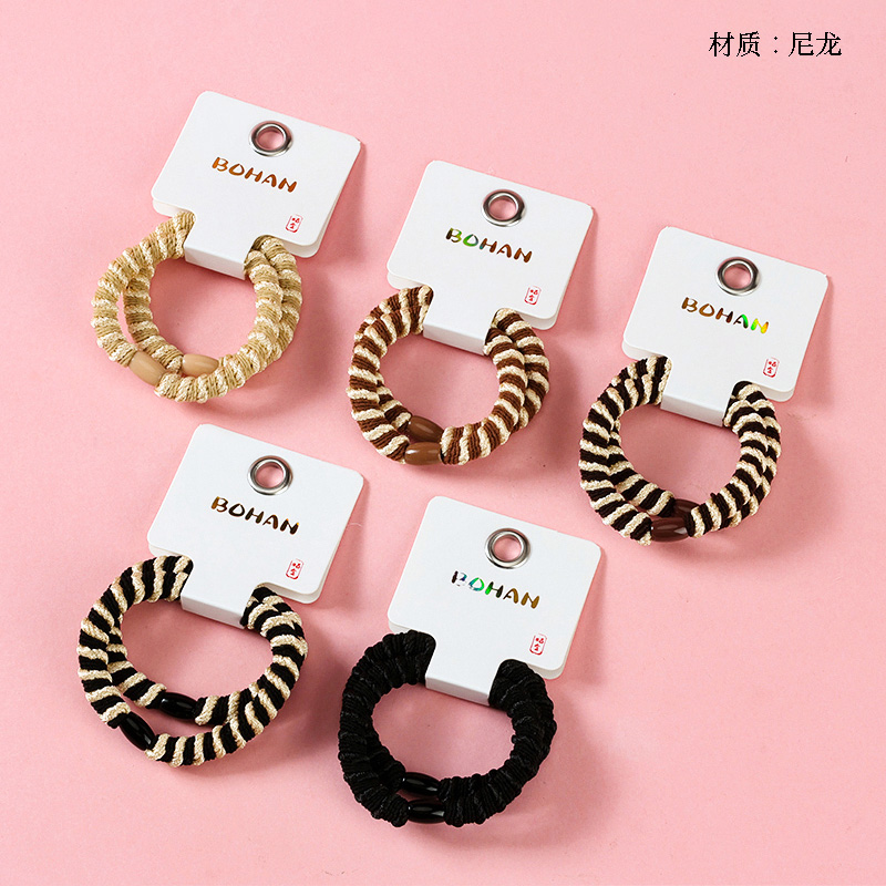 Boxed two thick two-color twisted rubber bands