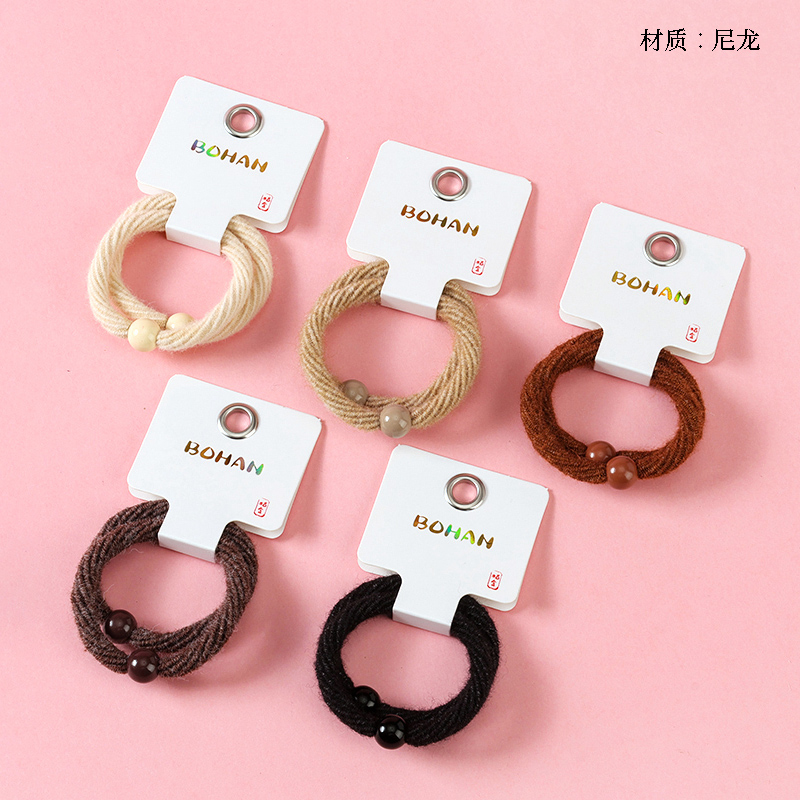 Boxed two curry-colored high-stretch twill bands