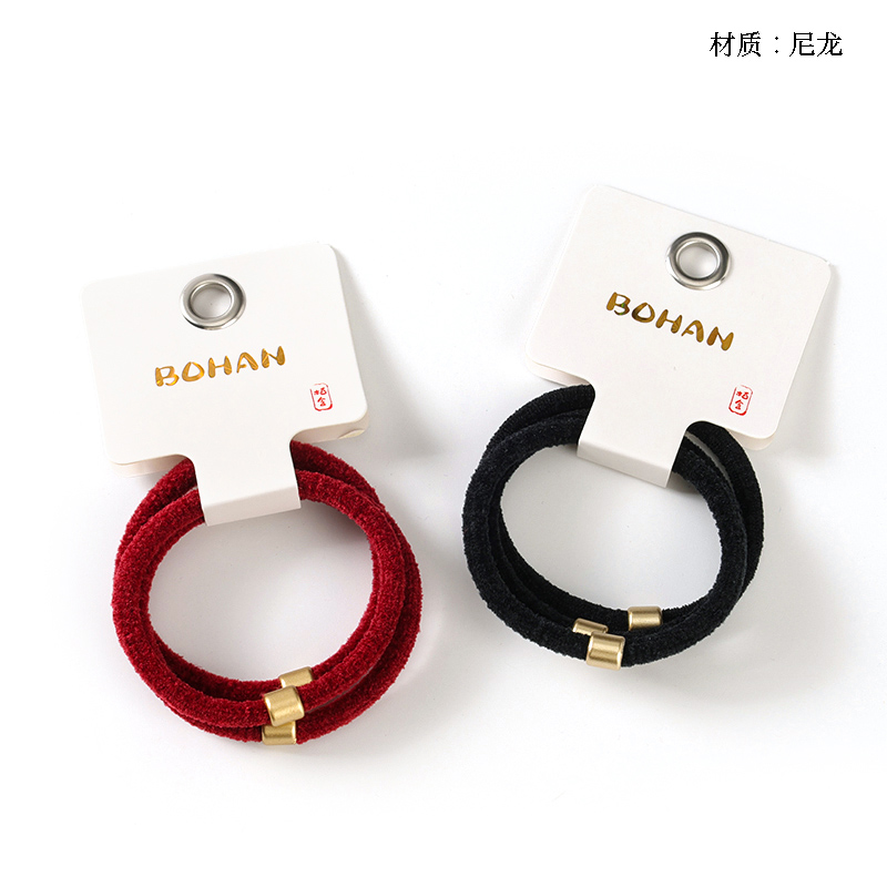 Boxed three dark flocked rubber bands