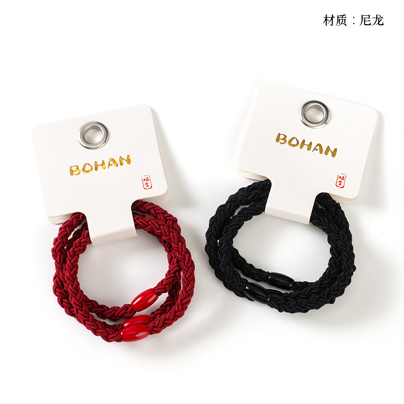 Boxed three red and black braided bands