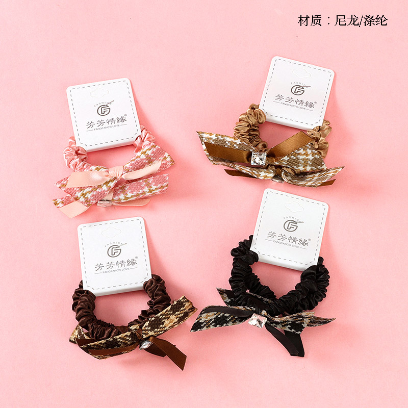 Two large bow tie fabric rubber bands