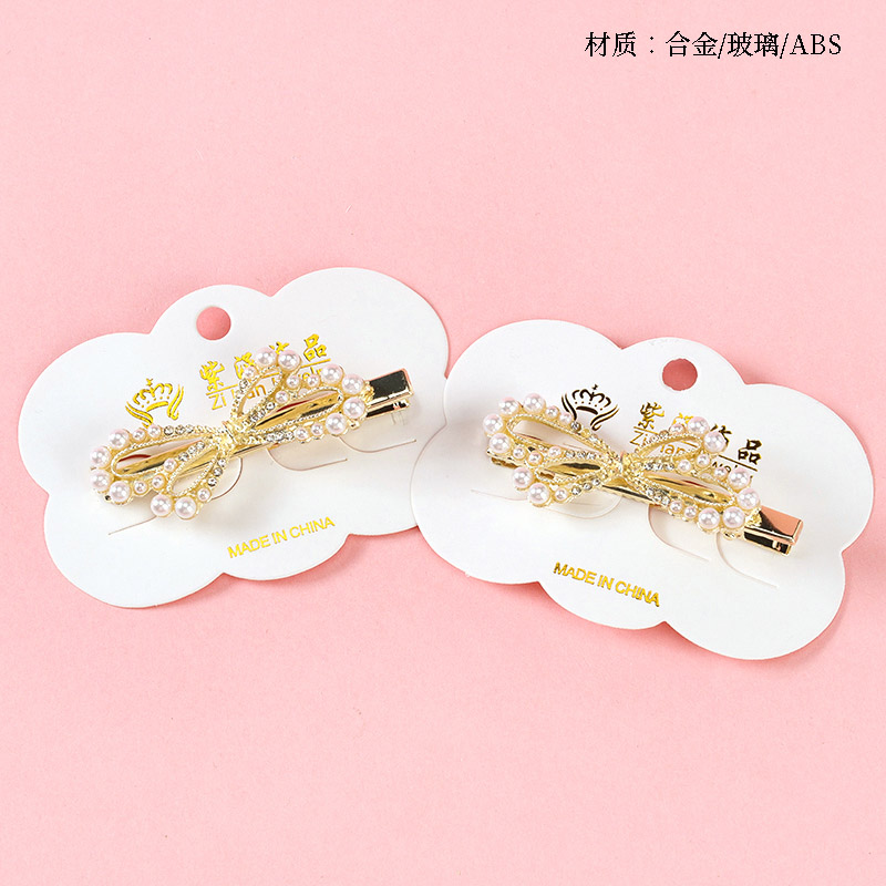 Bagged Pearl Bow Duck Clip