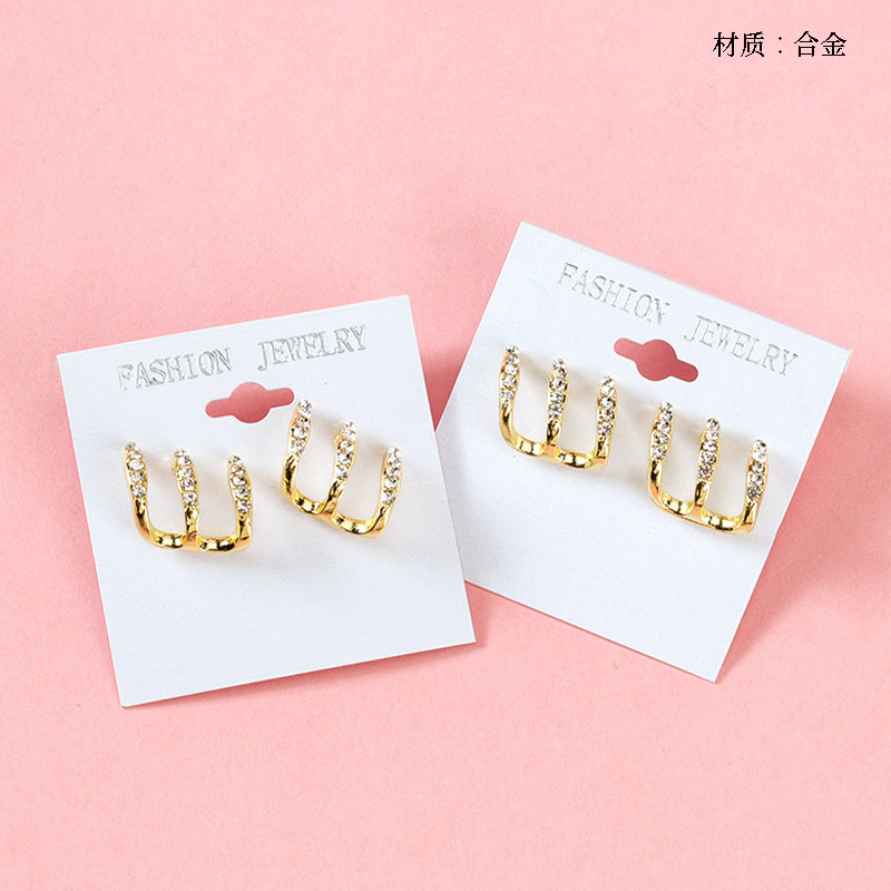 Three rows of studded earrings