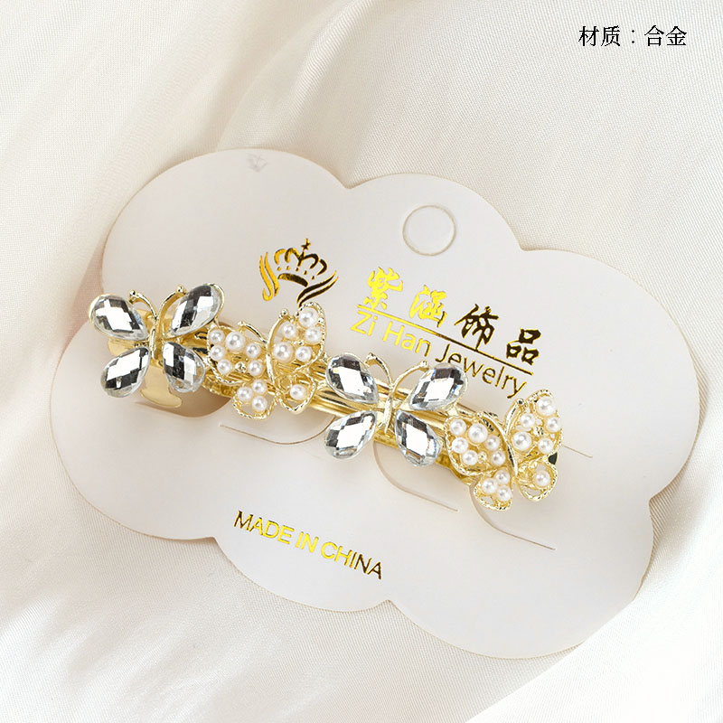 Four zircon pearl butterfly cross clip