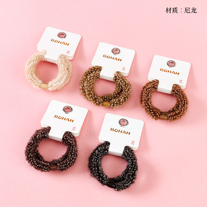 Boxed two curry-colored curly corn bands