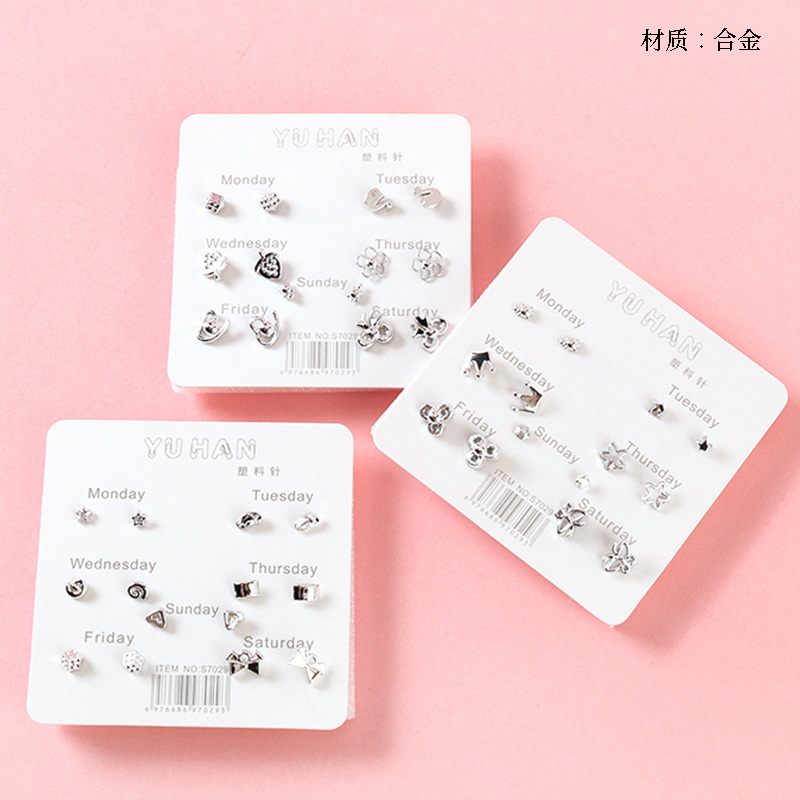 Seven pairs of small fresh silver stud earrings