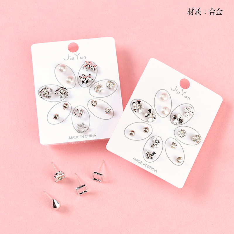 Seven pairs of point drill alloy pearl earrings