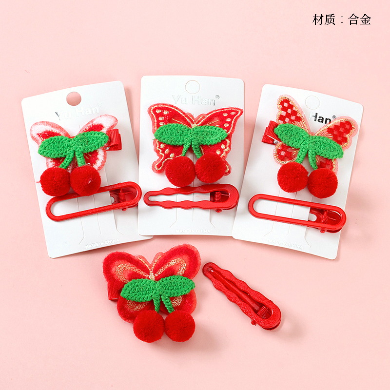 Boxed red cherry butterfly duck clip