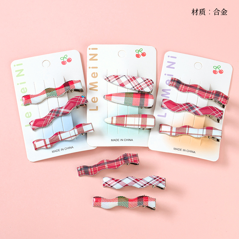 Boxed three red striped duck clip