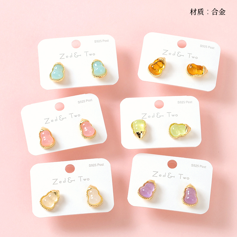 Long gold-rimmed gourd earrings