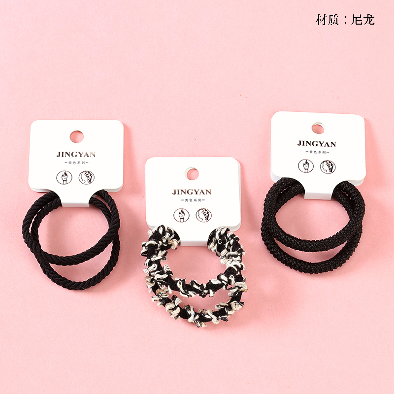 Boxed two miscellaneous black rubber bands