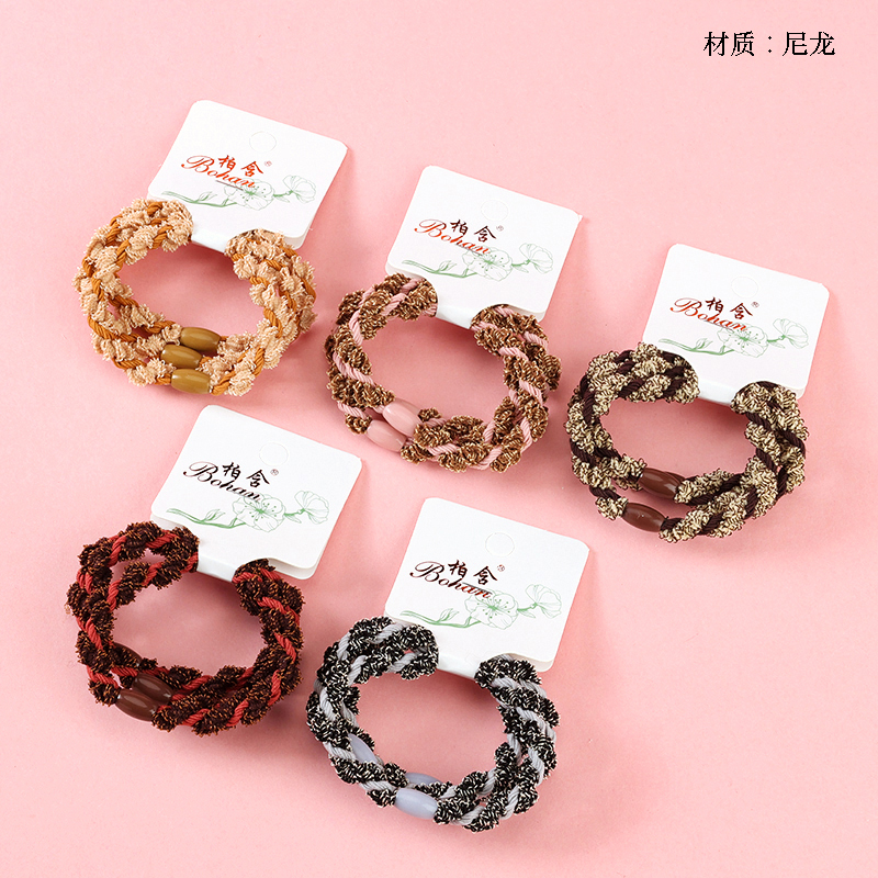 Boxed three contrasting twisted rubber bands