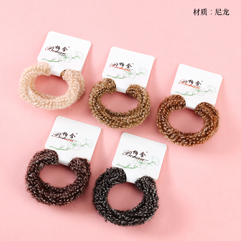 Boxed two curry-colored fluffy rubber bands