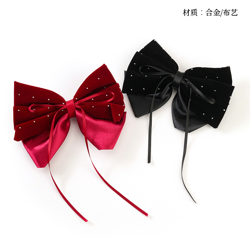 Boxed double-piece rhinestone bow duck clip