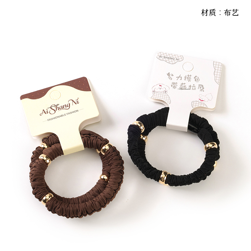 Boxed two new gold bead fabric rubber bands