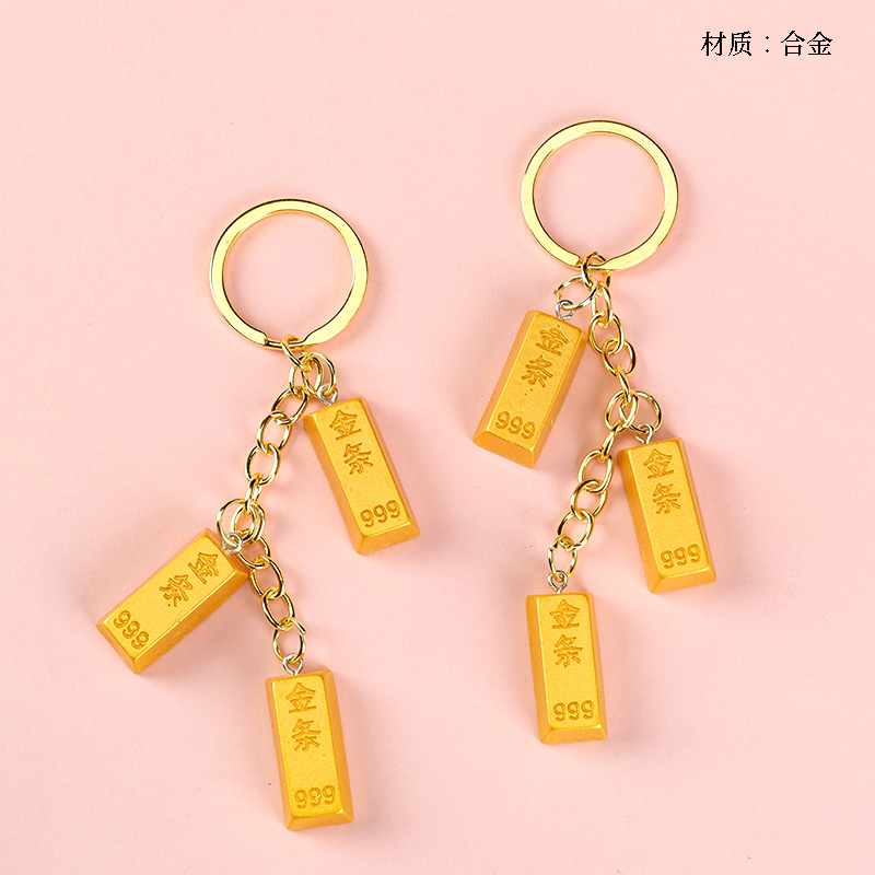 Three gold bar pendants