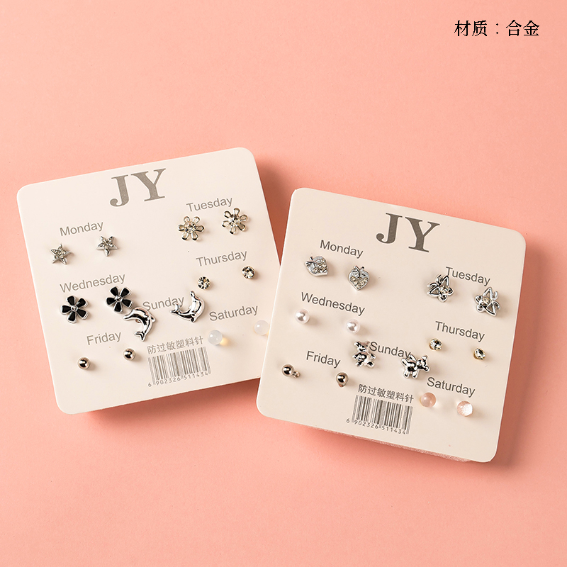 Seven pairs of silver diamond combination stud earrings