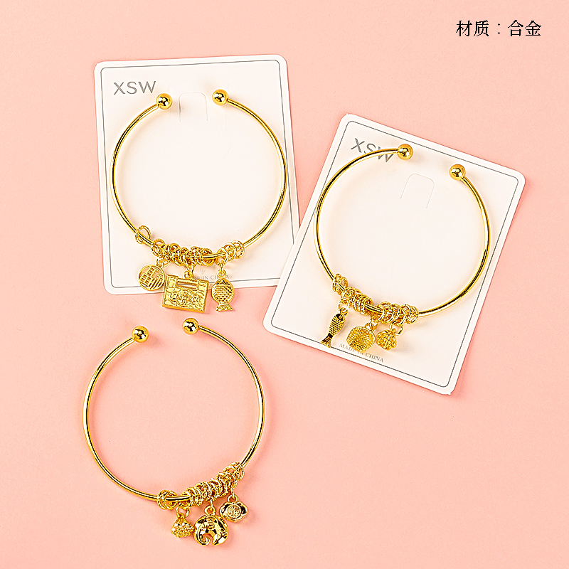 Gold tag coiled open bracelet