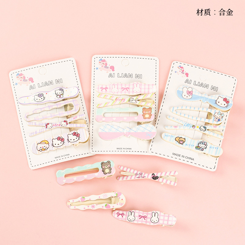 Boxed four KT cat print style duck clip