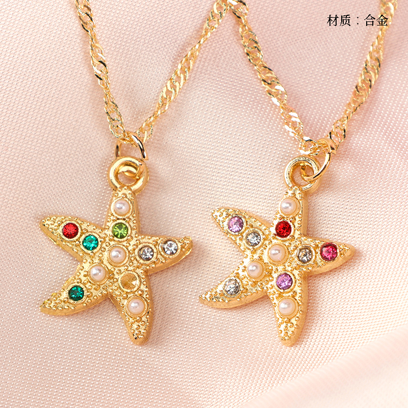 Gold colored diamond starfish necklace