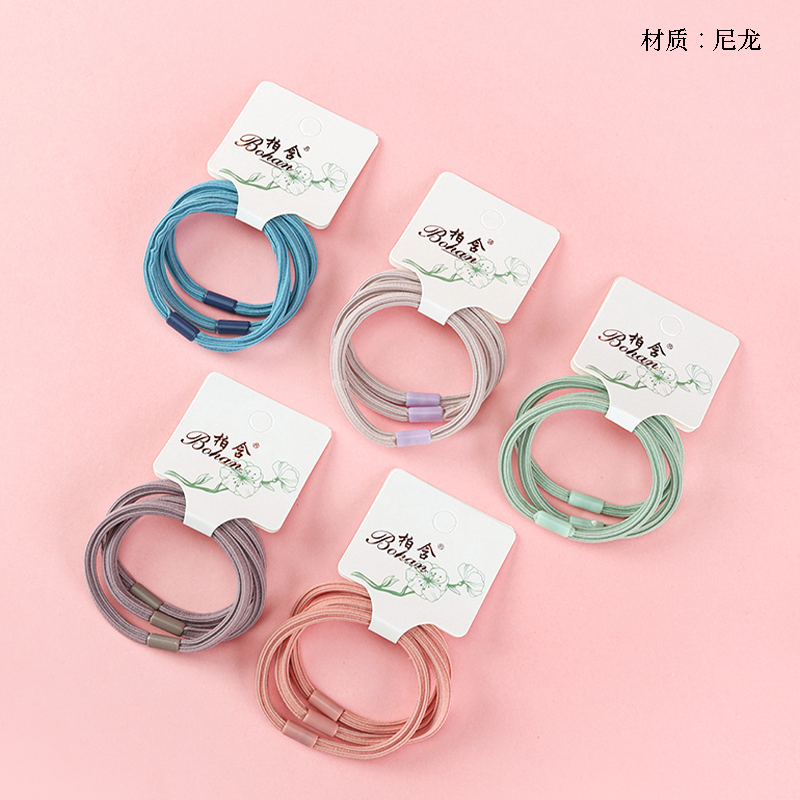 Boxed three colored square rubber bands