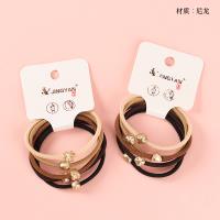 Boxed Five Mini Gold Nylon Hair Ties 4012202217